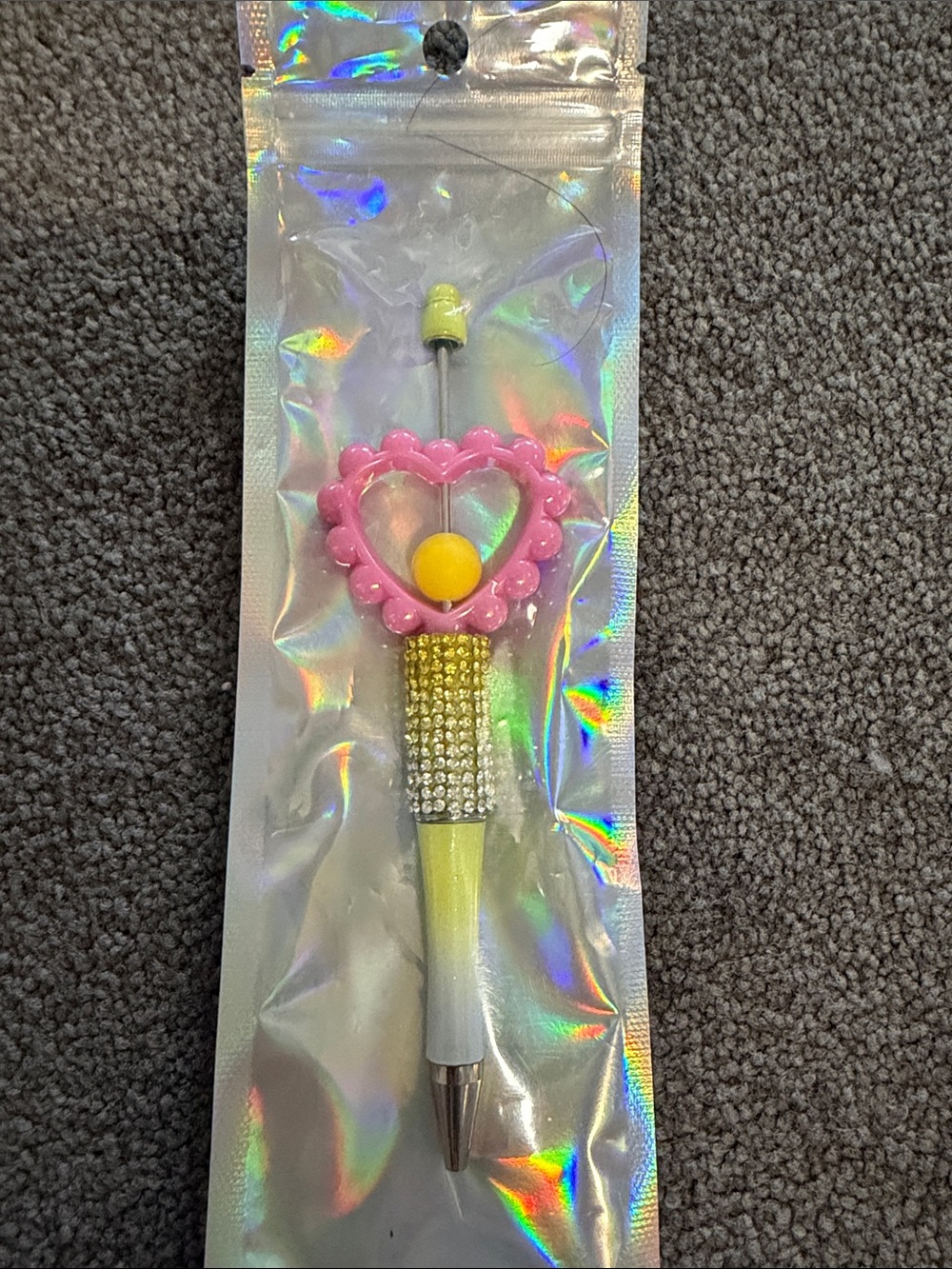 yellow beaded pen with pink heart